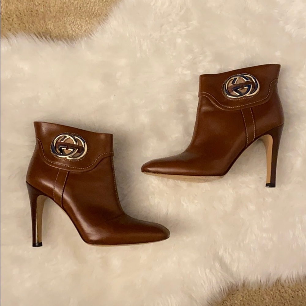 Gucci “GG Logo” brown leather ankle boots.